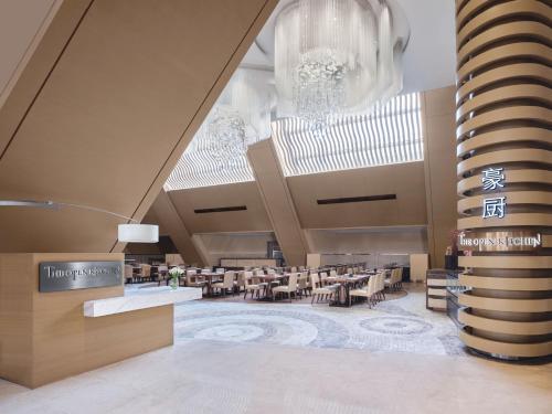 a rendering of a restaurant with tables and chairs at Langham Place Guangzhou - Walking distance to Canton Fair in Guangzhou