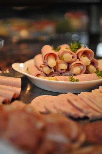 a plate of food with mushrooms on a table at Vareler Brauhaus-Hotel Varel Dangast in Varel