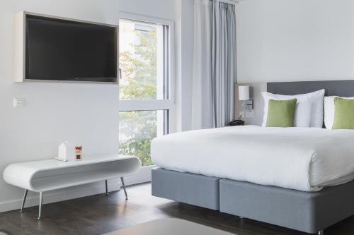 Postel nebo postele na pokoji v ubytování Base Nyon