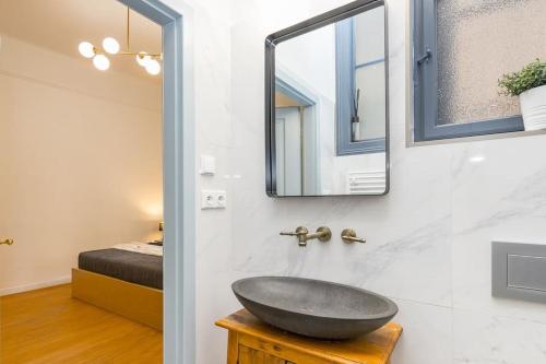 a bathroom with a sink and a mirror at Designed Spacious Flat with 2 Bedroms and Balcony in Prague