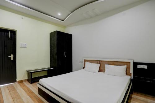 Voodi või voodid majutusasutuse OYO The Nirvana Resorts toas