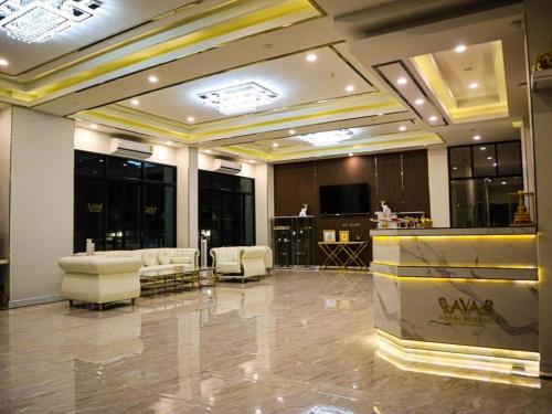 a lobby with couches and a bar in a building at โรงแรม ไอยรา ริเวอร์ไรน์ นครพนม (AIYARA RIVERINE) in Ban Nong Puk