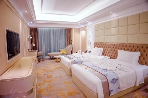 Ένα ή περισσότερα κρεβάτια σε δωμάτιο στο Khemarak Hotel 凯娜酒店