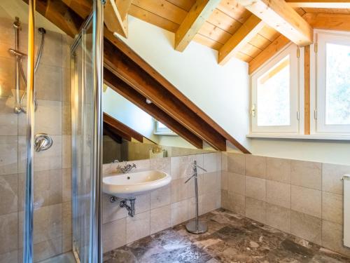 a bathroom with a sink and a shower at Residence Villa Greta in Meina
