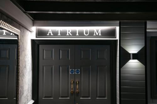 a sign above the door of a entrance to a gym at Best Western Manor Hotel in Gravesend