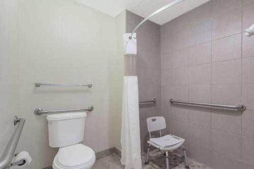 a bathroom with a toilet and a shower at Travelodge by Wyndham Clarksville in Clarksville