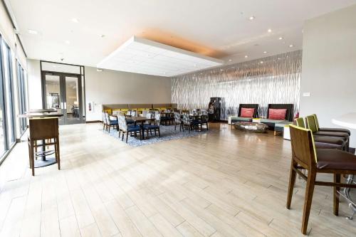a dining room with a table and chairs at Hilton Garden Inn Austin Airport in Austin