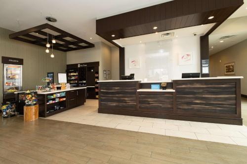 a store lobby with a cash register and a counter at Hilton Garden Inn Austin Airport in Austin