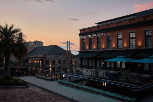 a view of a building with a hotel next to it at The Cotton Sail Hotel Savannah - Tapestry Collection by Hilton in Savannah