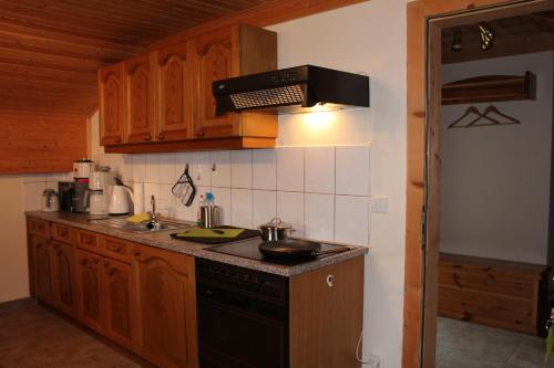 a kitchen with a sink and a stove top oven at Haus Johanna in Radstadt
