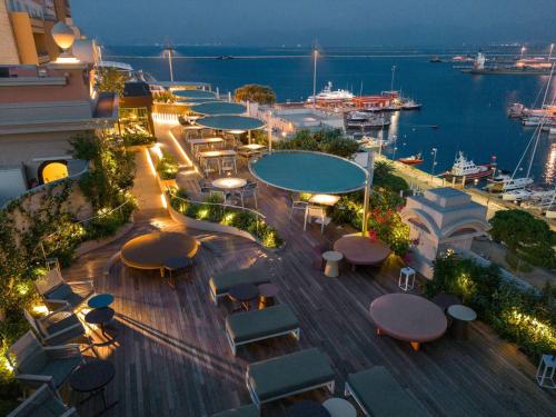 an overhead view of a city with tables and chairs at Palazzo Tirso Cagliari MGallery in Cagliari