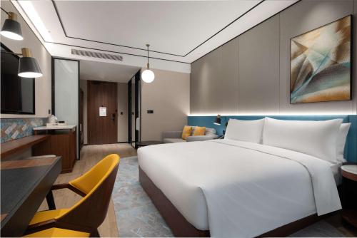 Postel nebo postele na pokoji v ubytování Hilton Garden Inn Beijing Daxing Jinyuan Road
