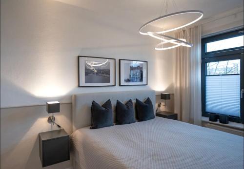 Cama ou camas em um quarto em Modern, ruhig, gemütlich: 2 Zimmer Wohnung in bester Lage nahe Alster + Stadtpark