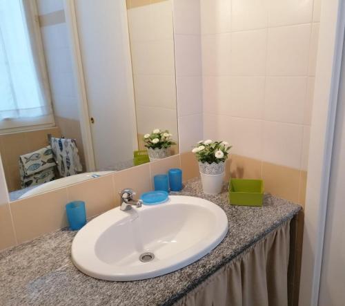 a bathroom with a sink and a mirror at Brezza di Lago in Stresa