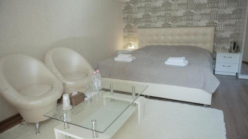 Ένα ή περισσότερα κρεβάτια σε δωμάτιο στο Hotel Kalyan & Spa