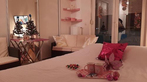 a room with a bed with christmas decorations on it at Pink Panter Doboj in Doboj