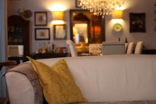 a couch with two pillows on it in a living room at The Blue House in Tolmin
