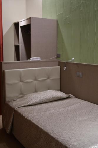Hotel Baffo Rossoにあるベッド