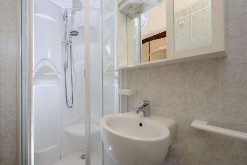 Koupelna v ubytování Hotel Mimosa