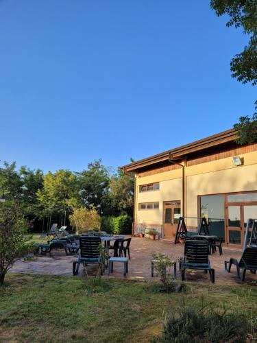 a group of benches sitting outside of a building at Park Hotel Bellavista in Gambarie dʼAspromonte