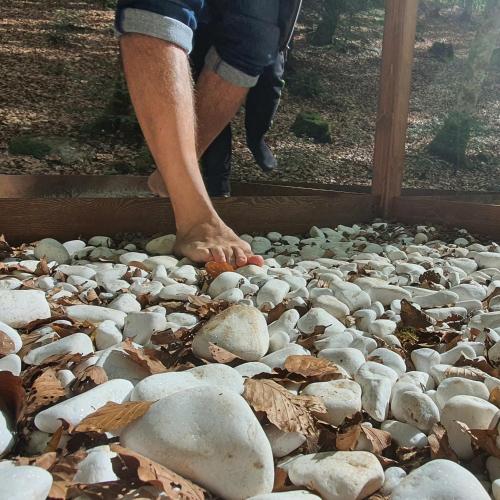 a person standing on a pile of rocks at Park Hotel Bellavista in Gambarie dʼAspromonte