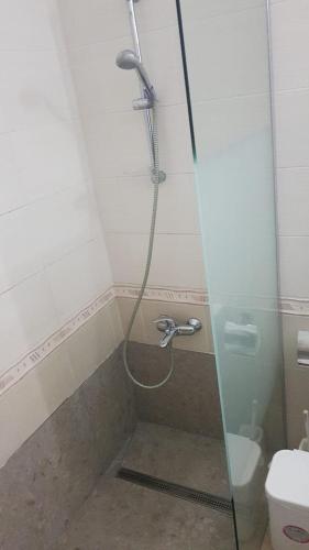 a shower in a bathroom with a toilet at Hermes Complex 2 Paralimni Cyprus in Paralimni
