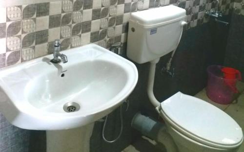 a bathroom with a sink and a toilet at Vedanta Homestay by StayApart in Mangpu