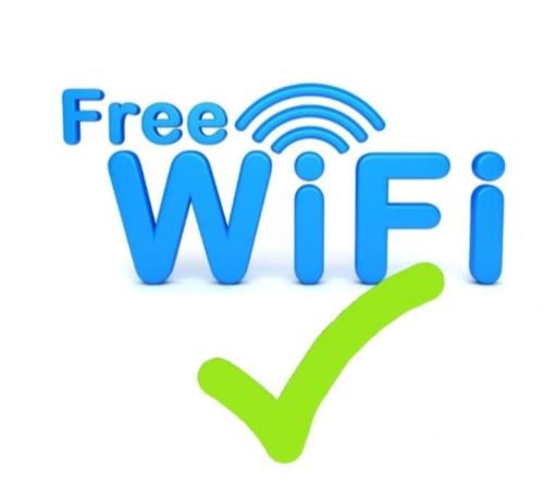a free wifi logo on a white background at Apartmani S - DSN in Kraljevo