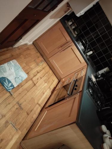 an overhead view of a kitchen with wooden cabinets at Knightsbridge Crystal Haven in London