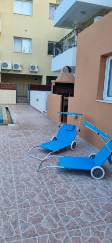 a blue scooter on the floor of a building at Hermes Complex 2 Paralimni Cyprus in Paralimni
