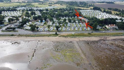 an aerial view of a parking lot next to the beach at Seton Sands Holiday Village Klover in Port Seton