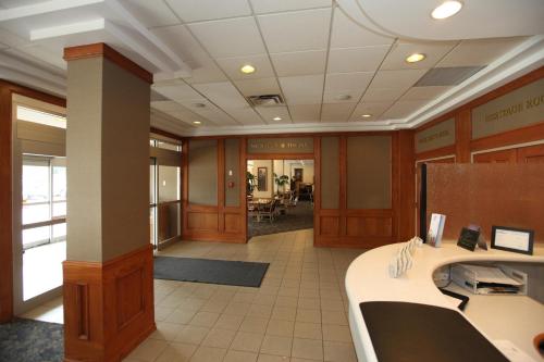 a large room with a large desk and a large window at St. Albert Inn & Suites in St. Albert