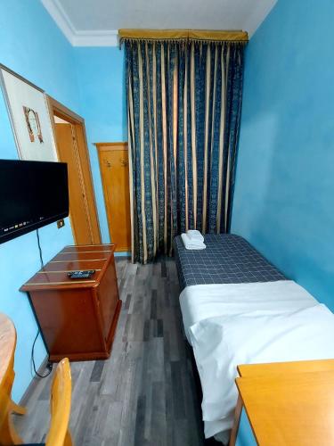 Postel nebo postele na pokoji v ubytování Hotel Positano 2