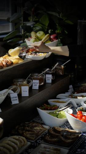 a buffet of different types of food on display at TbiliSee Hotel in Tbilisi City