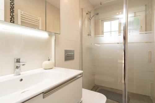a bathroom with a toilet and a sink and a shower at Charming two bedroom house close to the sea in Marbella