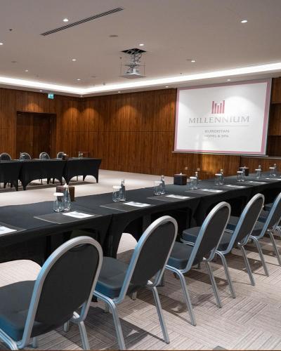 a conference room with a long table and chairs at Millennium Kurdistan Hotel & Spa in As Sulaymānīyah