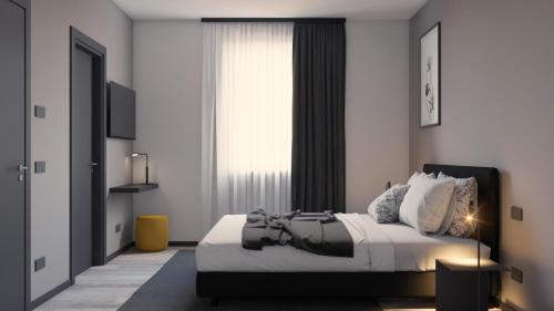 Ένα ή περισσότερα κρεβάτια σε δωμάτιο στο Residence Il Melograno