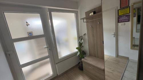 a hallway with two sliding glass doors in a building at Villa Zigana in Mostar