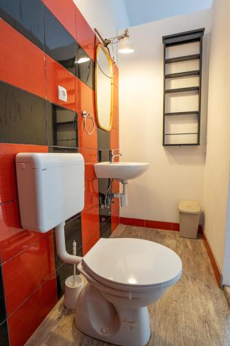 a bathroom with a toilet and a sink at BEACH HOUSE CASKA in Novalja