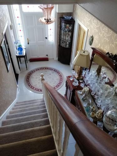 a staircase in a house with a stair case at Glenart House in Tramore