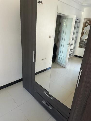a large glass door in a room with a hallway at saveliving in Dakar