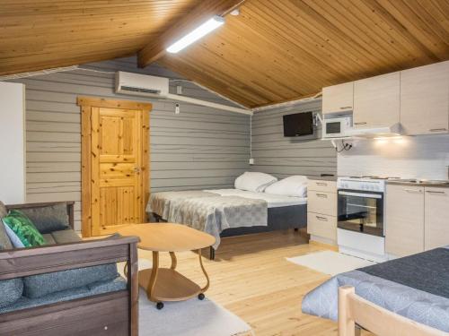 a small room with two beds and a kitchen at Holiday Home Nilla 3 by Interhome in Utsjoki