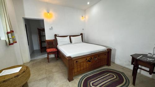 Letto o letti in una camera di Kinazi Upepo Beach Eco Sport Resort