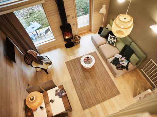 an overhead view of a living room with a couch at Holiday Home Honka a by Interhome in Napapiiri
