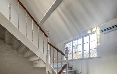a staircase with a window and a stair case at Villa Sommarro in Ystad