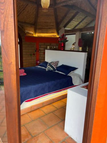 Cama o camas de una habitación en MALOKAS AGUA VIDA & NATURALEZA