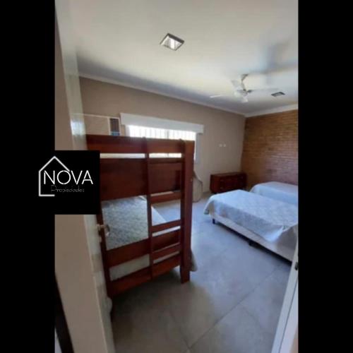 a bedroom with a bunk bed and a bed sqor at COMPLEJO E.Y in Paso de la Patria