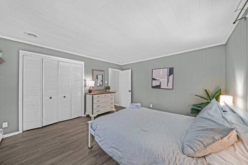 a bedroom with a bed and a dresser in it at 1255 Ashbridge, West Chester, PA in West Chester