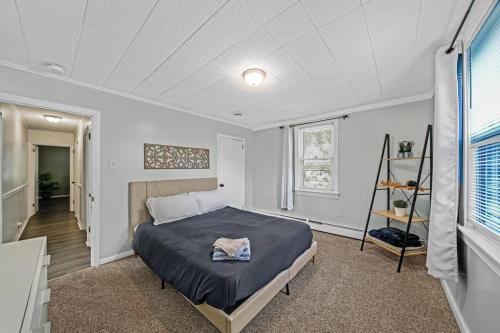 a bedroom with a bed and a shelf in it at 1255 Ashbridge, West Chester, PA in West Chester
