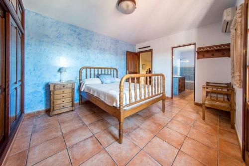 a bedroom with a bed and a dresser and a mirror at 4 bedrooms villa with private pool terrace and wifi at Sant Josep de sa Talaia 2 km away from the beach in Sant Jordi